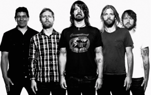 Foo Fighters band members starting from the left: Pat Smear, Nate Mendell, Dave Grohl, Taylor Hawkins, and Chris Shiflett. Courtesy of Consequence of Sound.